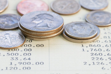 Coin stack on account book bank
