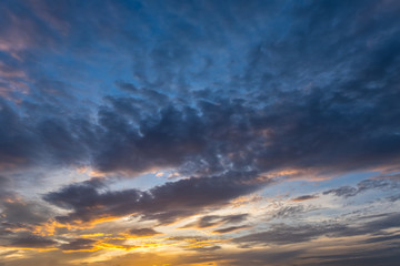 Dramatic sunset and sunrise dark vivid colorful cloud in sky.