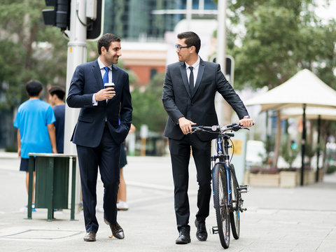 Young businessmen with a bike