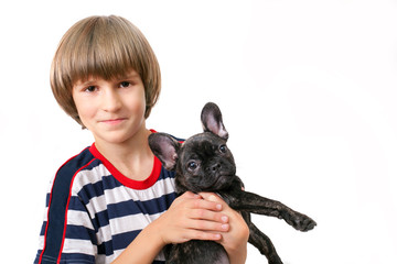 A young boy with french bulldog, isolated on white background