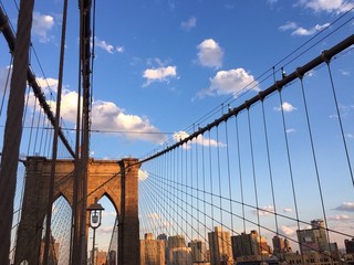 Brooklyn bridge and building of Manhattan city with blue sky, New York