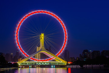 Obraz premium Night scene cityscape of Tianjin ferris wheel,Tianjin eyes with