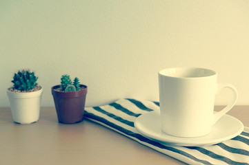 A Cup Of Coffee With Small Cactus On Wooden Table, Vintage Style
