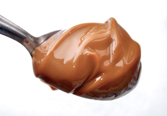 A Spoon with Milk Caramel Spread better nown as Dulce de Leche.