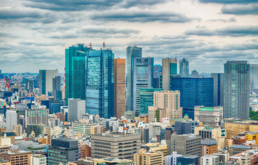 Obraz premium TOKYO - MAY 2016: Aerial view of city skyline. Tokyo attracts 15