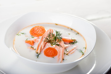 Creamy soup with salmon and vegetables