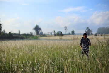 Man and White field grass flower at Thailand