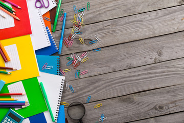 School supplies on the wooden table with copy space