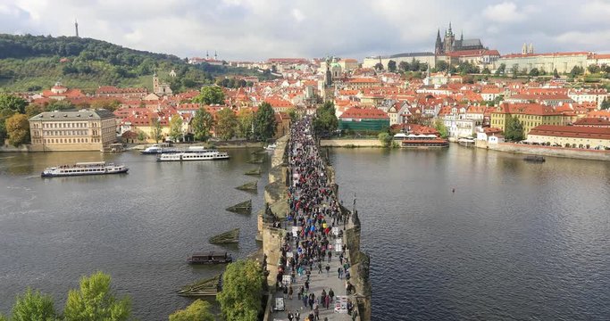 People walking on Charles Bridge - static view from Staromestska bridge tower, Parague, Czech Republic
