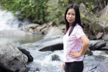 Thai woman with Mae Ya waterfall, Chiangmai Thailand
