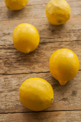 Lemon on old wooden background.