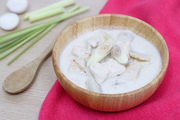 Thai sour chicken soup in wood bowl