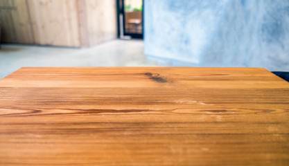 Wood table top on blurred room