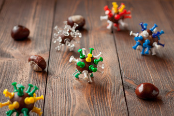 Viruses made with chestnuts and pins as crafts for kids