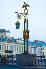Fototapeta na wymiar Lantern on Panteleymonovsky Bridge across the Fontanka River in Saint Petersburg, Russia
