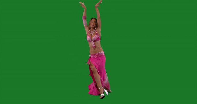 Bellydancer full shot. Beautiful belly dancer dancing ethnic dances. green screen. In sexy pink dress dancing. Model release. Long shot . 4K