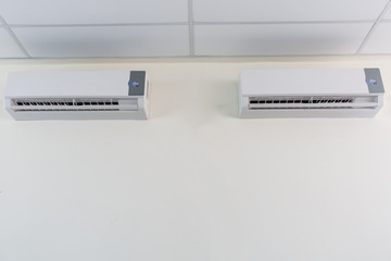 Air conditioner split type embed on wall of living room., Twin a