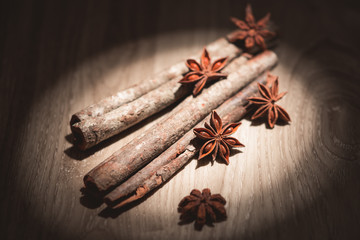 Cinnamon stick and star anise spice decorated on wooden backgrou