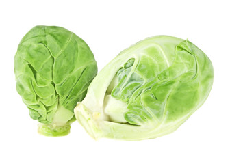 Obraz premium Close up view of two heads of brussels sprout on white backgroun