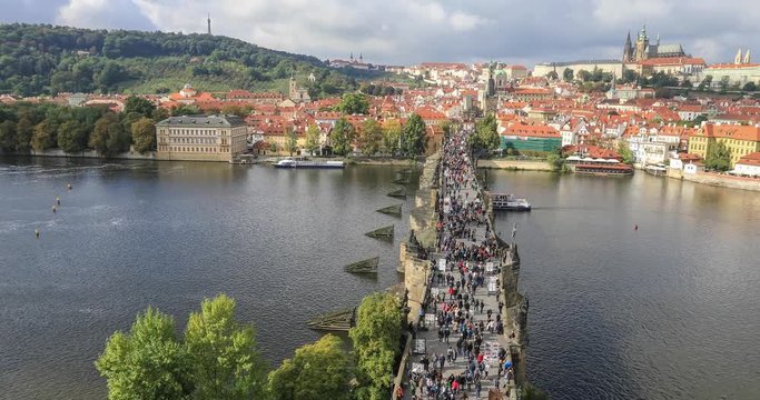 People walking on Charles Bridge - panoramic view from Staromestska bridge tower, Parague, Czech Republic
