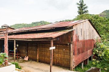 Fototapeta na wymiar House old wood and rust roof zinc in natural at thongphaphum, pilok, kanchanaburi