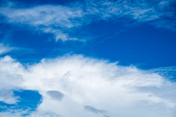 Naklejka na ściany i meble White cloud on blue sky