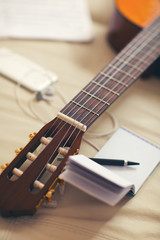 Fototapeta premium Guitar left on the sofa
