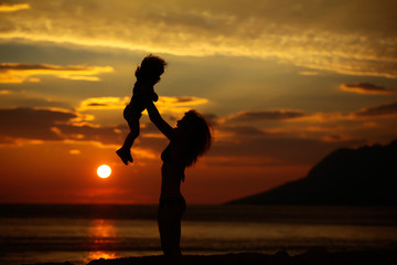 Fototapeta premium Mother and son on beach