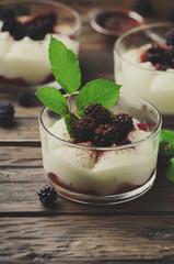 Homemade dessert with blackberry and cream