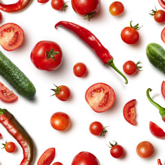 Red chili pepper, cucumber and tomato on white background .