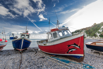 Fiherman boats on pebles at beach in Beer, Devon,UK