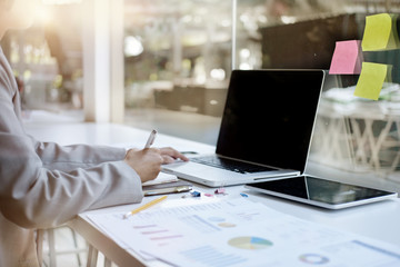 Woman sitting at desk and working at computer ,hands close up, Startup Concept