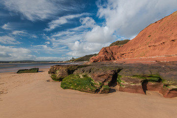 Fototapeta na wymiar Red cliffs on beach in Exmouth,UK