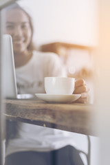 Beautiful girls using notebook computer in coffee shop