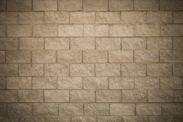 Wall of new gray bricks. Urban background. Toned