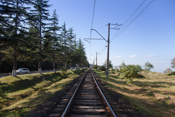 Fototapeta na wymiar Old railway on a Black sea coast in Georgia