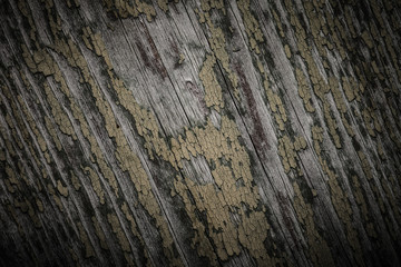 Old wooden planks with peeling paint like background. Toned