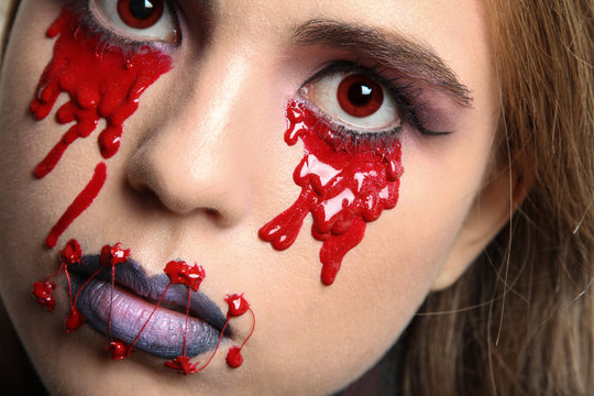 Beautiful girl with creative make-up for the Halloween party