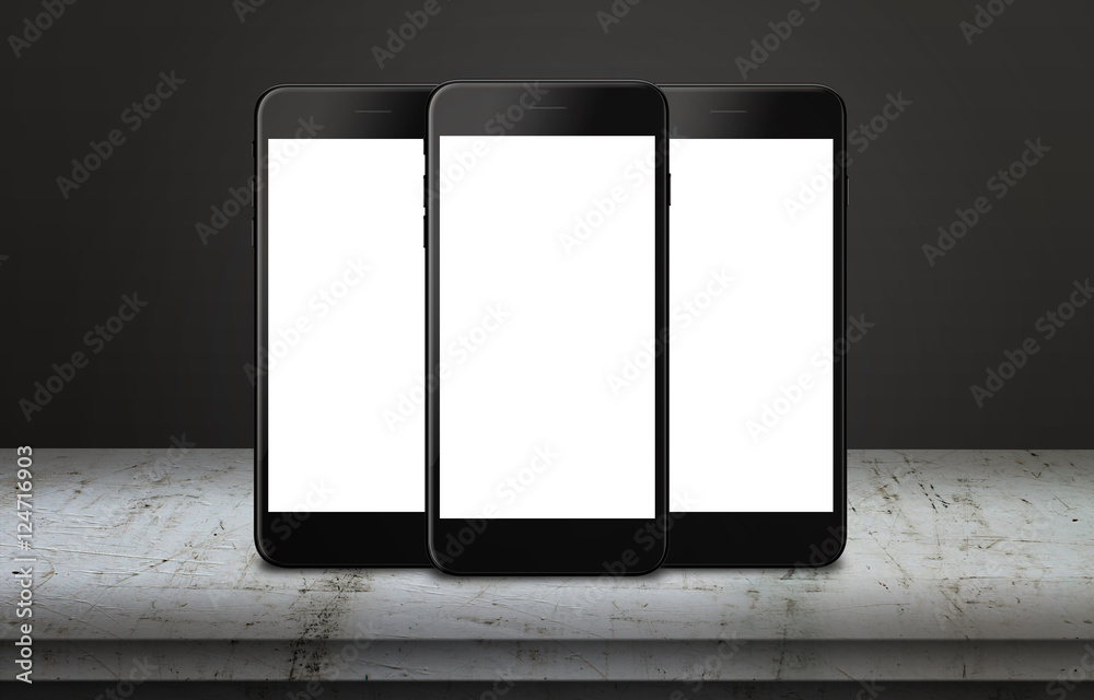 Aufkleber Three mobile phones on table with isolated display for mockup. Mobile app or web page presentation.