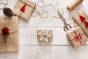 Gift wrapping. Packaging modern christmas present in boxes