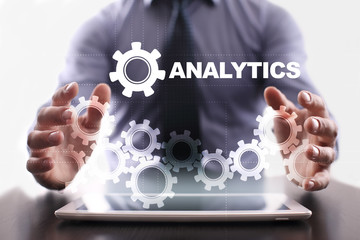 Fototapeta premium Businessman is using tablet pc and selecting analytics