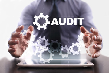 Businessman is using tablet pc and selecting audit