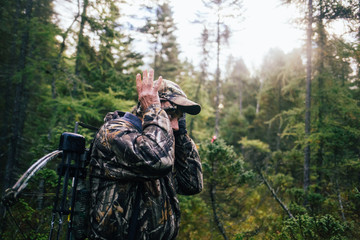 Hunter imitating a deer