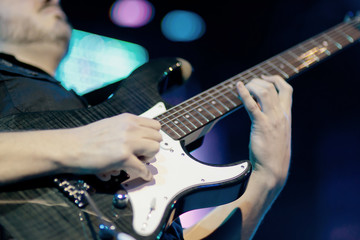 Obraz premium Guitarist solo on electric guitar
