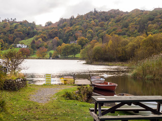 Rowing boats on Lake Grasmere at Autumn, Cumbria, UK