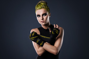 Woman mma fighter with yellow hair