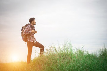 Young hipster man outdoor with backpack on his shoulder, Time to