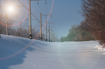 Railway power lines supports and wires, winter