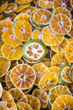 Stack of dried and sliced mandalin limes (known elsewhere as Mandarin or Rangpur limes) on display in a market in Turkey