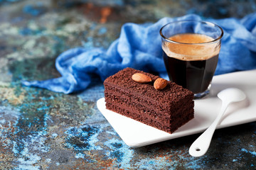Piece of chocolate cake and coffee, selective focus